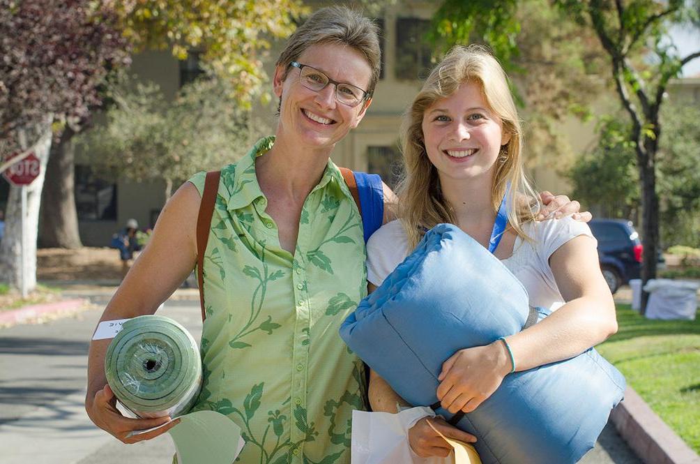 A parent helps her daughter move in on the first day at Pomona College.