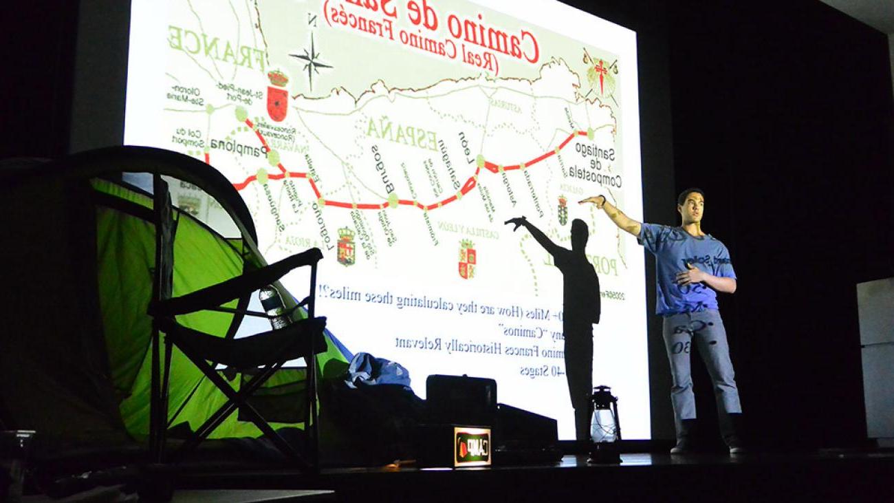 A student giving a presentation on Camino de Santiago